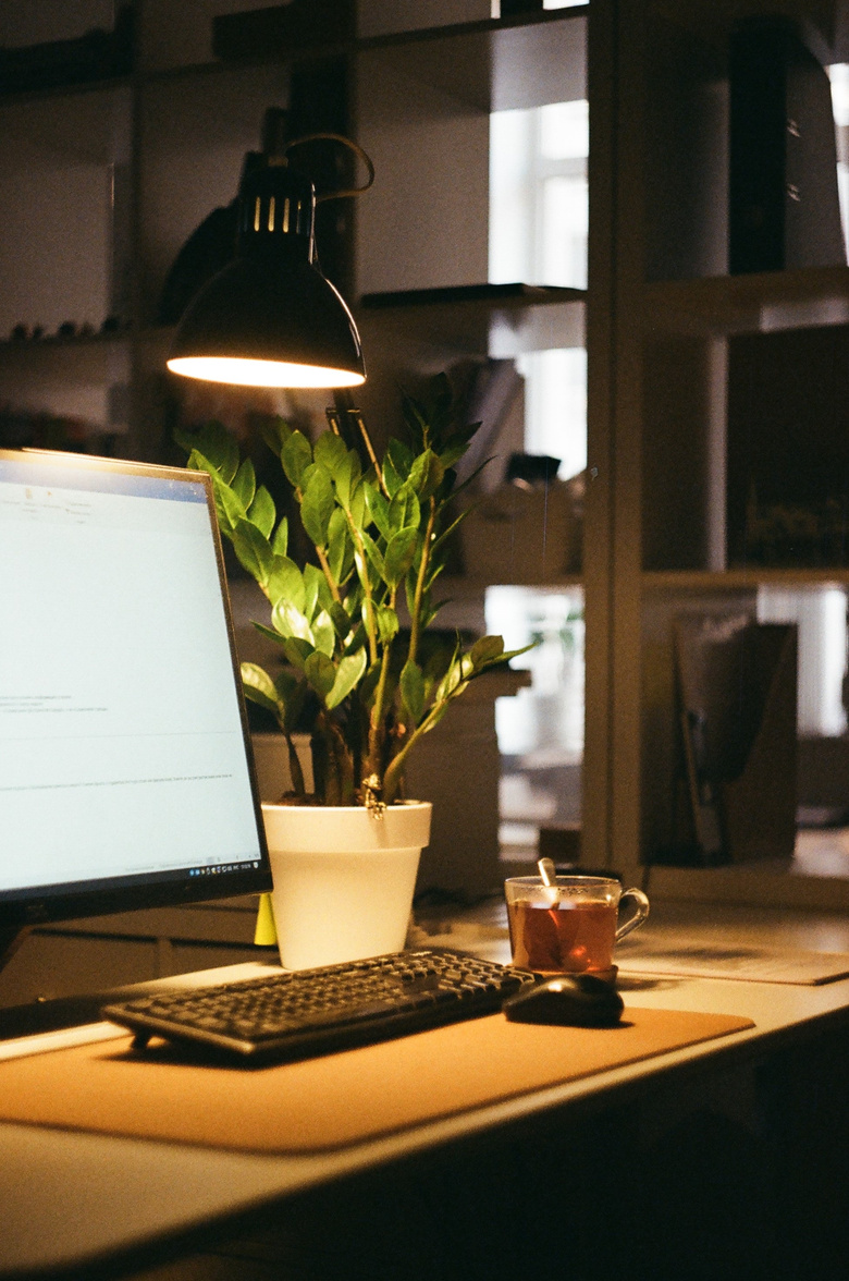 A Lamp on a Computer Desk